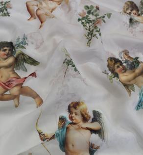 Шелк-шифон Dolce&Gabbana принт ангелочки на бежевом фоне | Textile Plaza